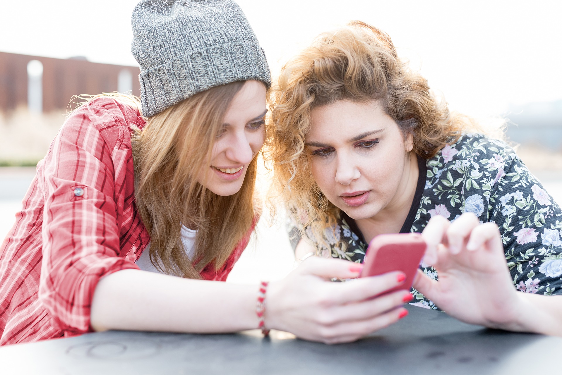 Two young woman looking at a phone