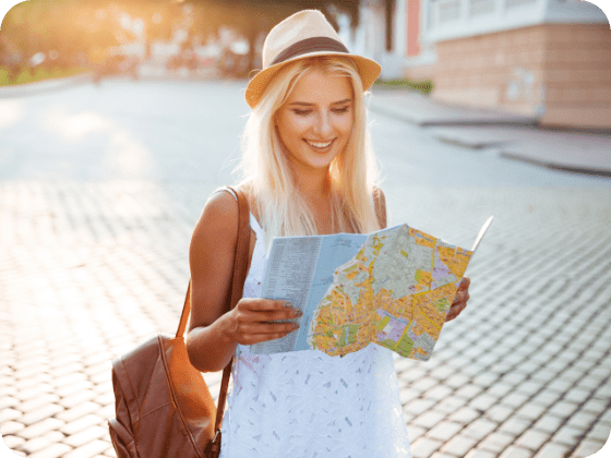 Woman smiling looking at a map