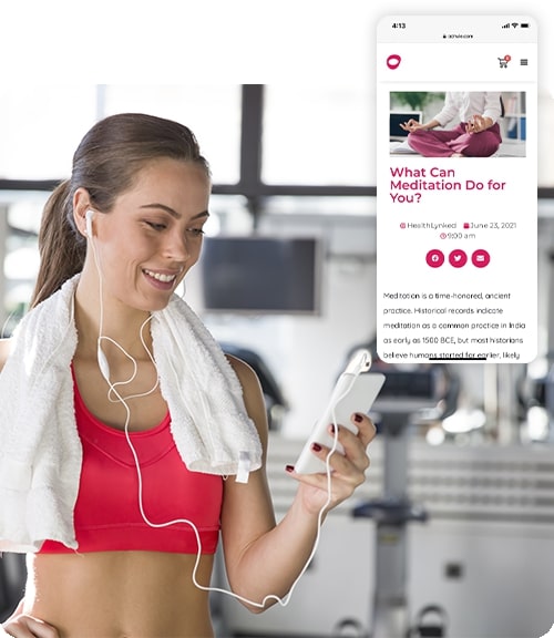 Woman working out looking at an Oohvie blog article on a phone